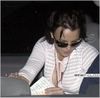 Britney Spears showing cleavage sitting in car